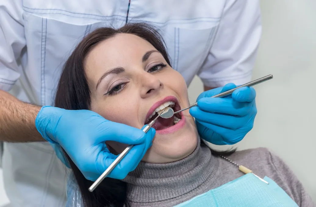 Dentist examining a patient chairside at Walnut Creek Dental